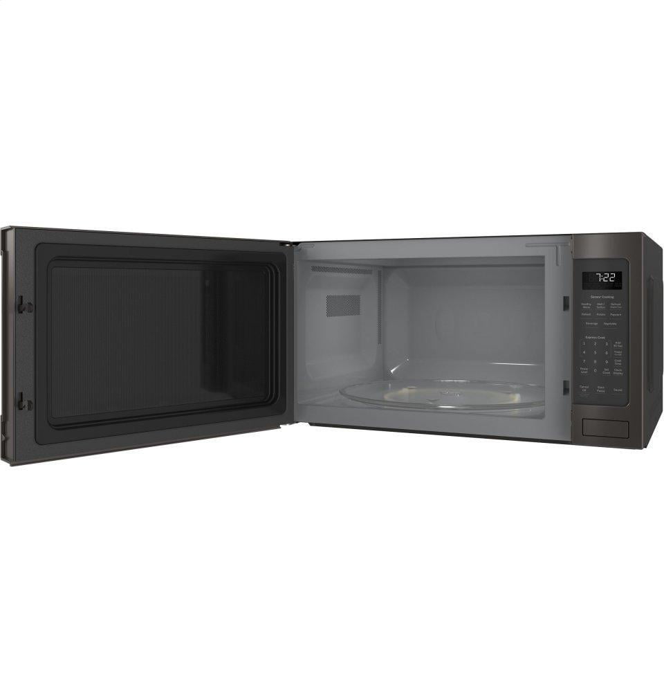 GE 2-cu ft 1200-Watt Sensor Cooking Controls Countertop Microwave (White)